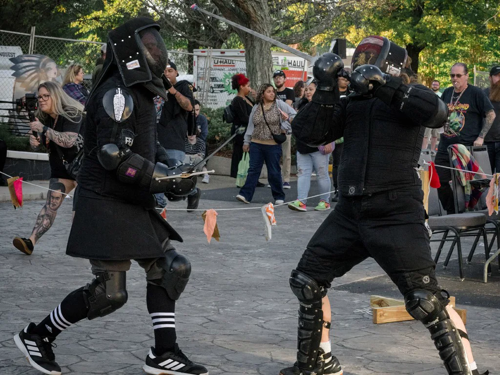 An armored bout drawing a crowd outside the hall